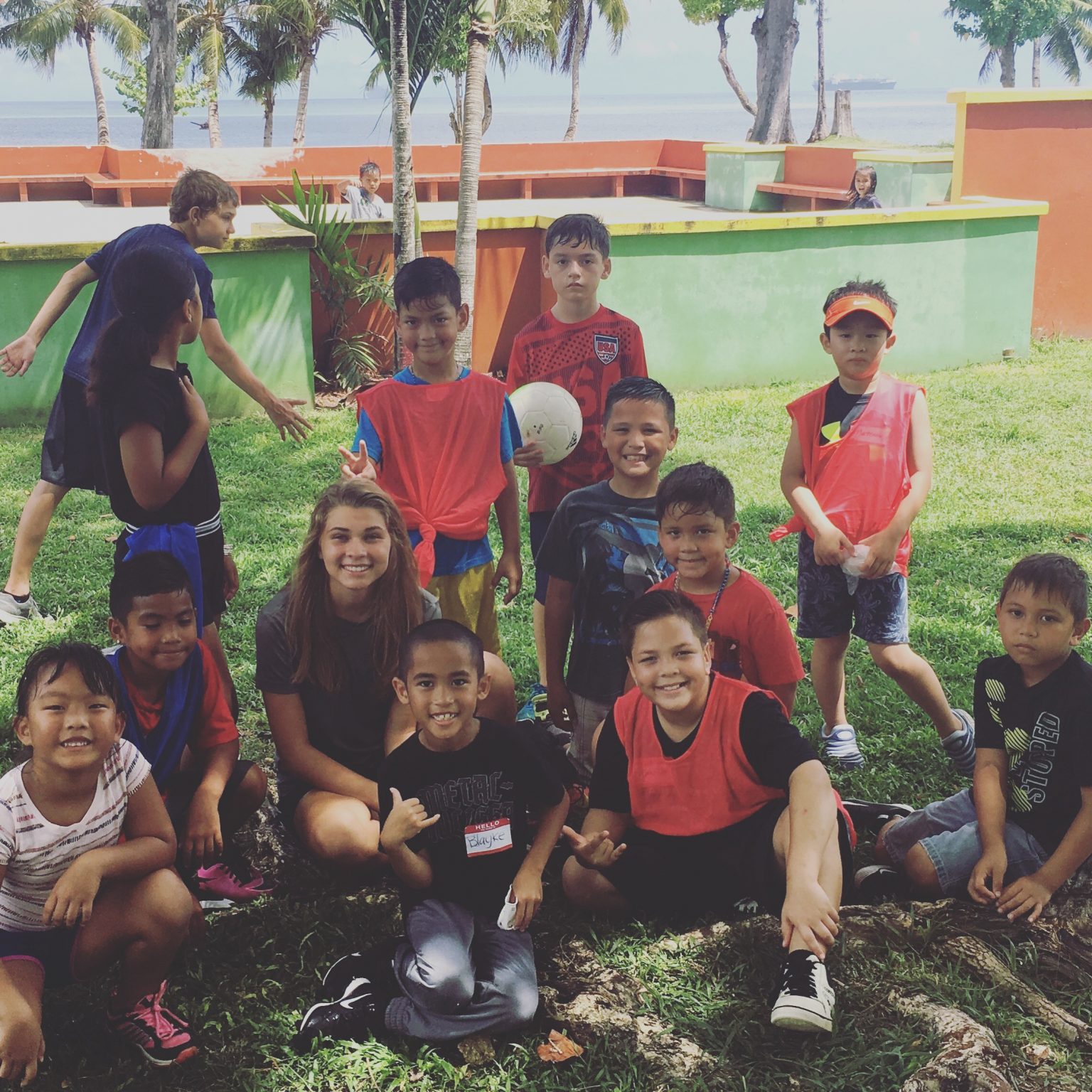 Esther with local Saipan village children.